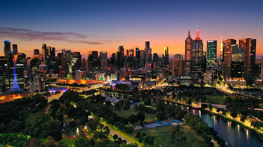 Melbourne skyline and Alexandra Gardens at sunset, covered by Melbourne Maxi Ride's standard taxi fleet