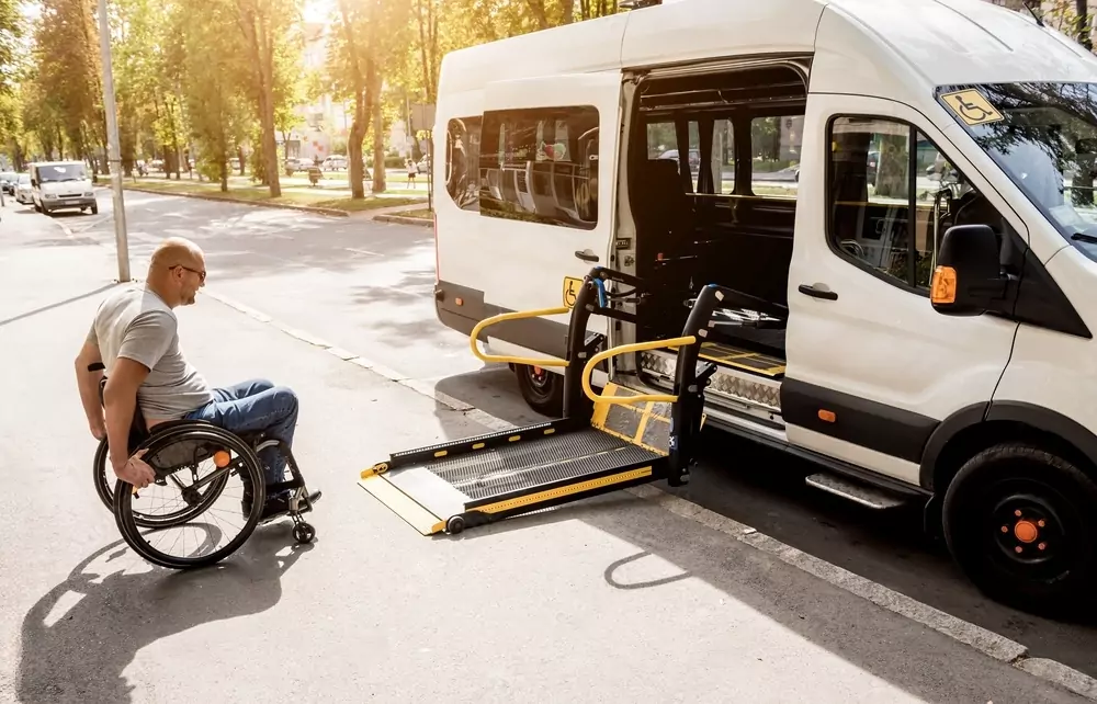 Wheelchair user approaching the ramp of a Melbourne Maxi Ride accessible taxi van