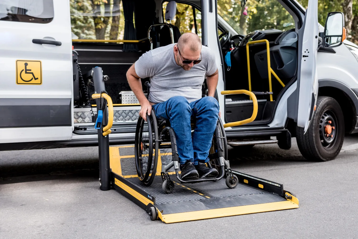Close-up of a wheelchair taxi ramp lift mechanism for safe boarding in Melbourne